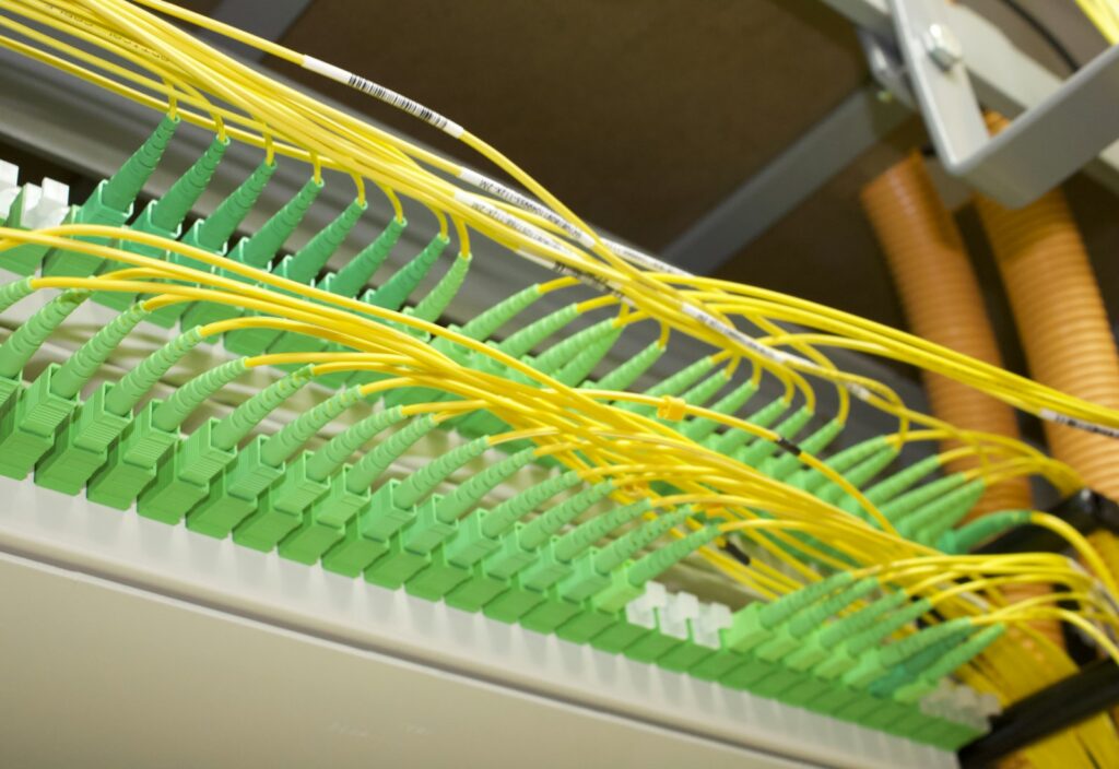 Fiber patch panel with connectors and yellow patch cords