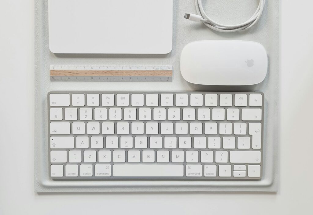 Keyboard, mouse and cable laid out on a desk