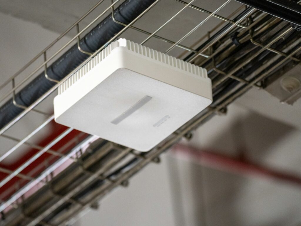 Wireless access point mounted near a ceiling cable tray